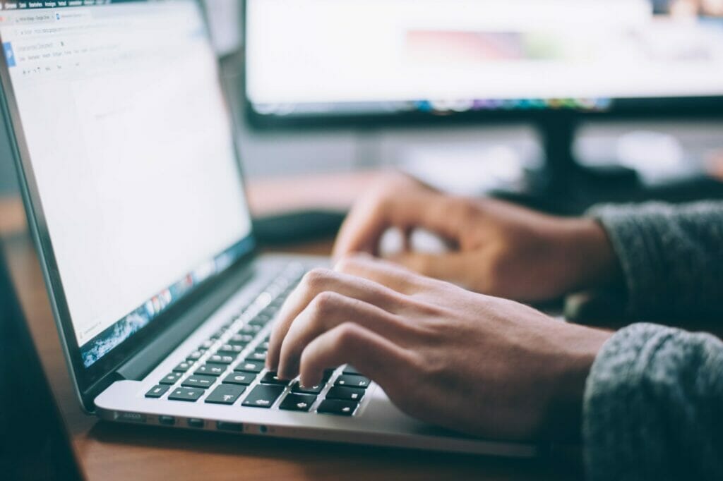 A pair of hands typing on an open laptop keyboard.

Photo by Glenn Carstens-Peters on Unsplash 