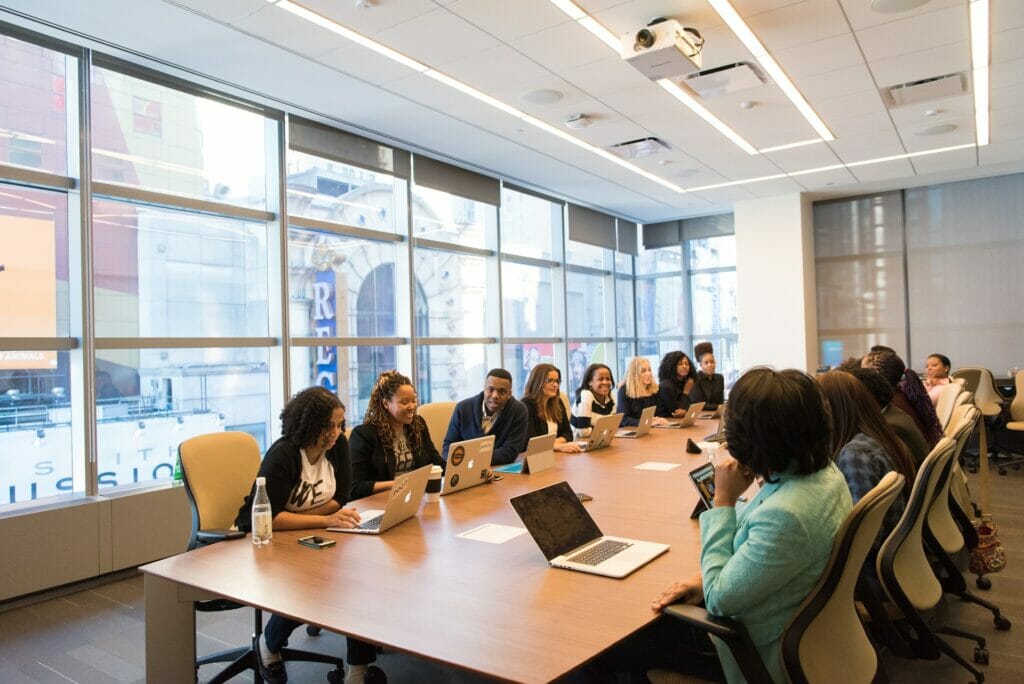 A large group of people participating at a training. 