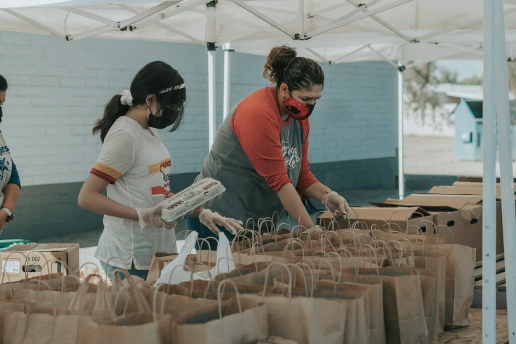 Few people working together to provide food to the local community.