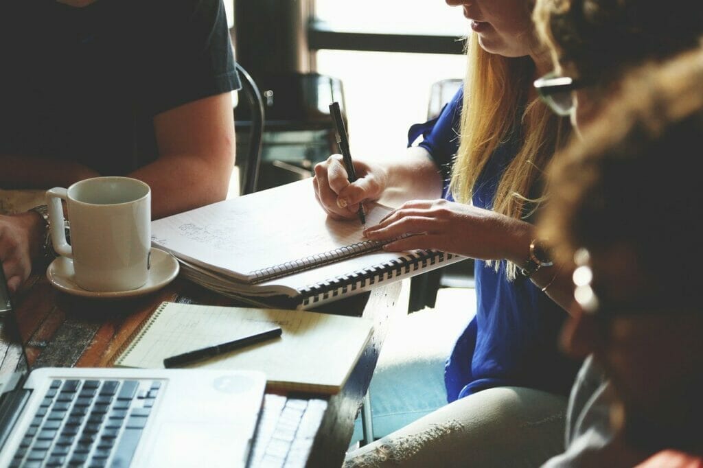 A groud of people sharing feedback to a role-holder during a performance review.