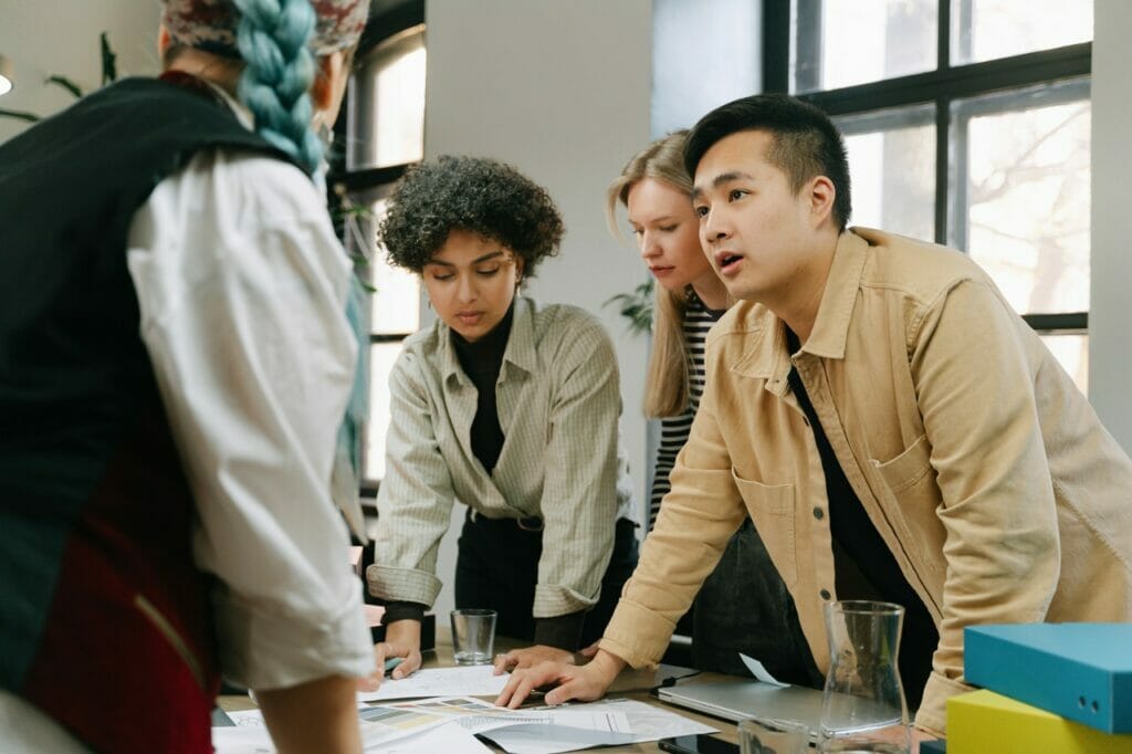 People of different gender, race and class meet together, cooperating with others.